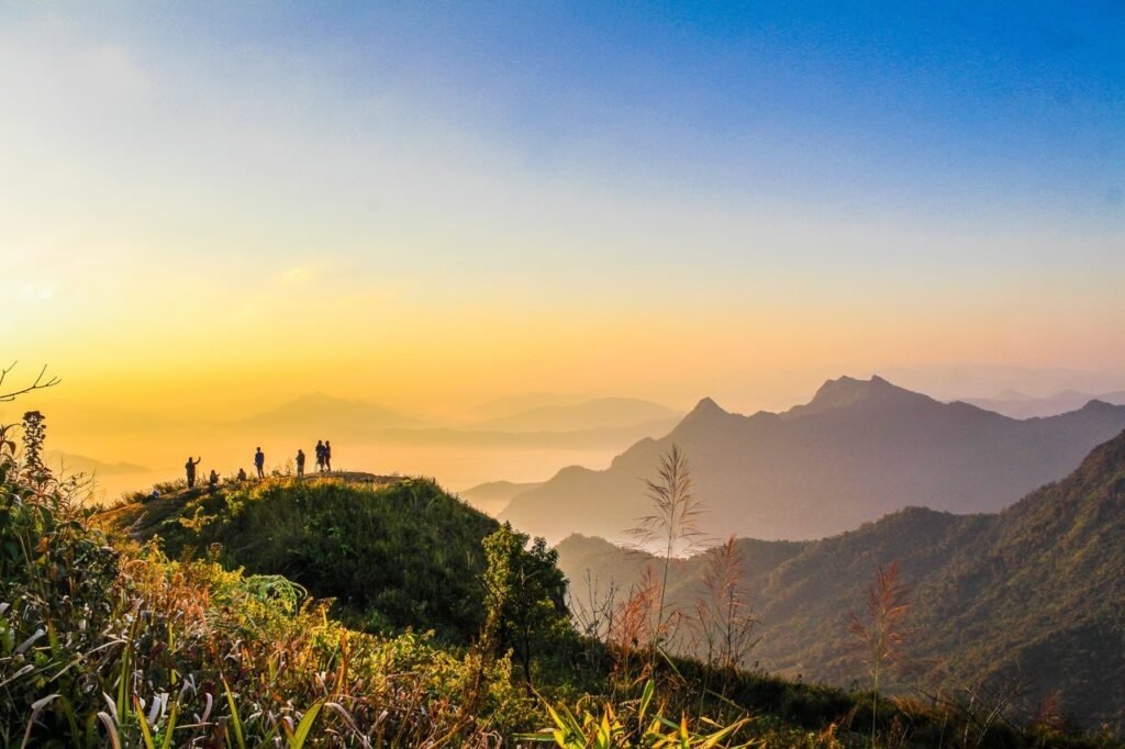 Hizmetlerimiz photo of people standing on top of mountain near grasses 733162.jpg